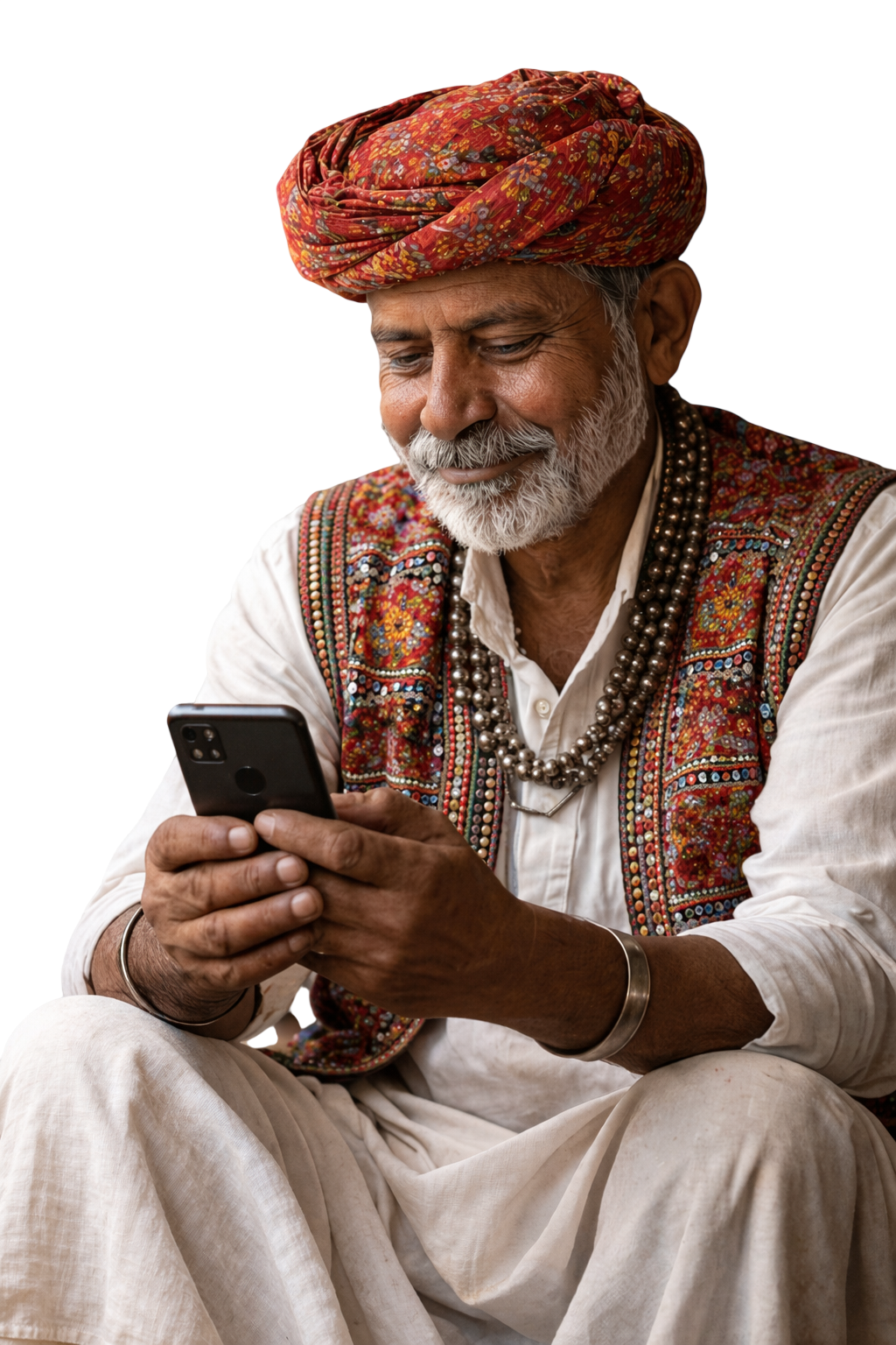 Elder Rajasthani craft entrepreneur in a patterned turban using a smartphone