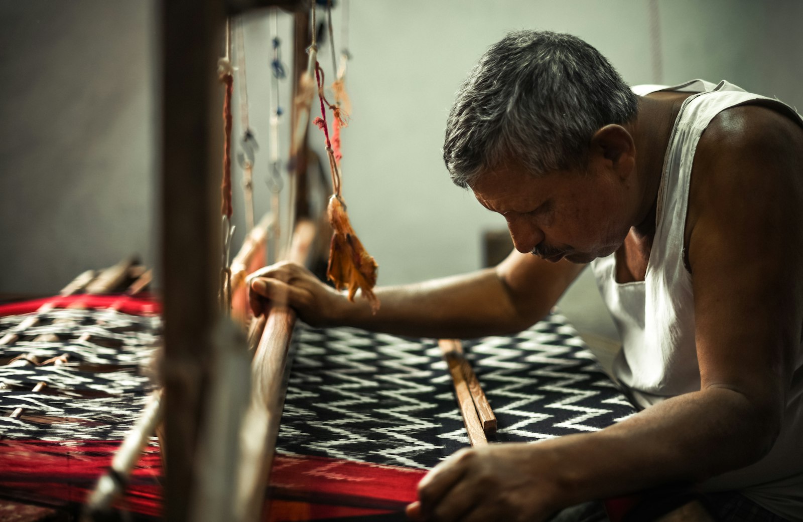 Indian handloom artisan at a traditional loom in Pochampally