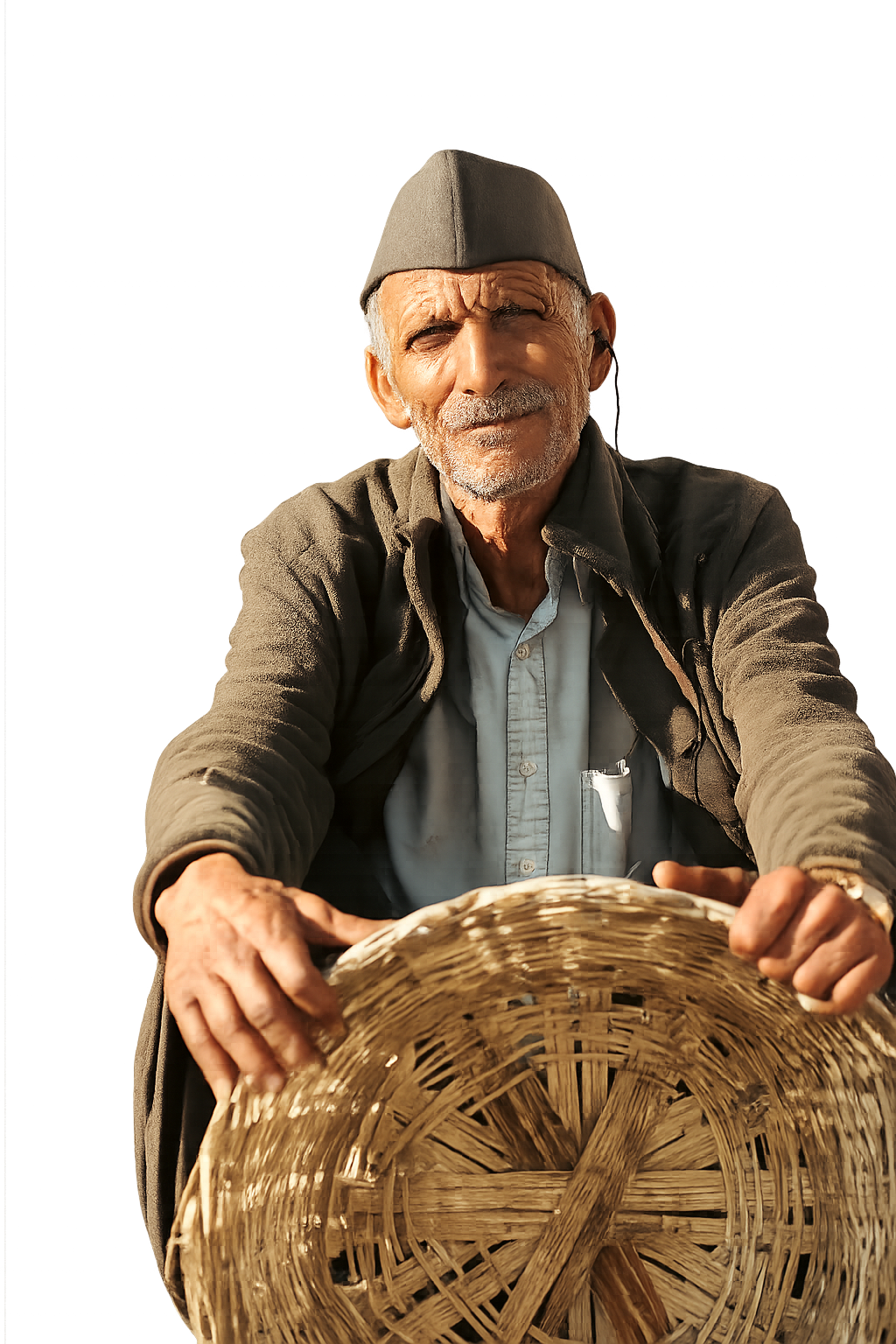 Kolti artisan holding a woven Ringaal bamboo basket