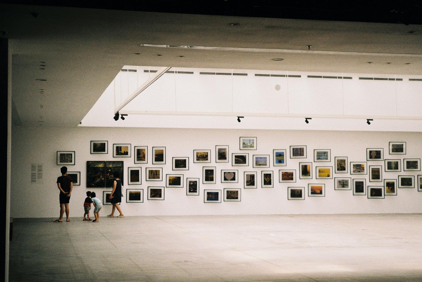 Visitors exploring an art and textile exhibition gallery